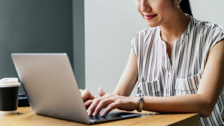 Woman using a laptop for marketing videos